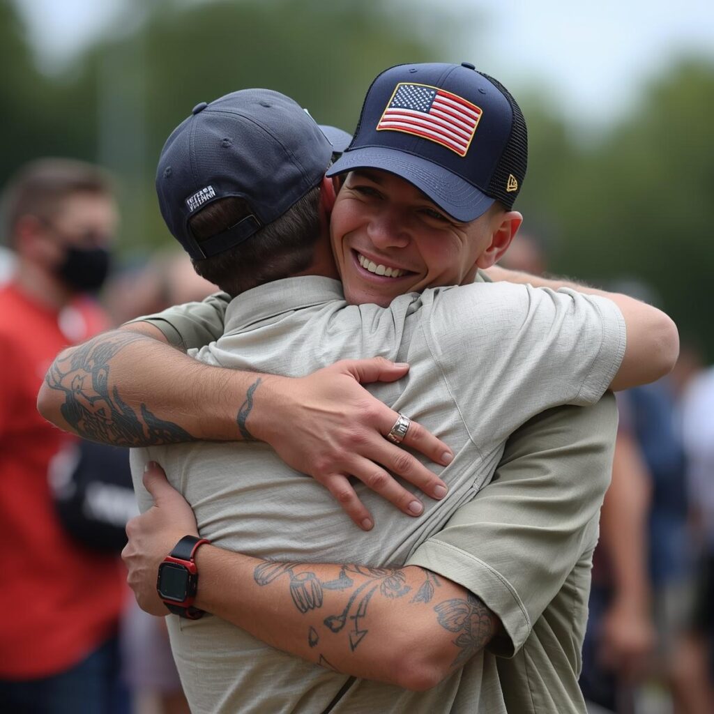 hugging a young man with a us veteran ball cap on